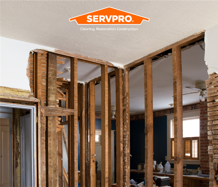house that needs reconstruction services with SERVPRO logo