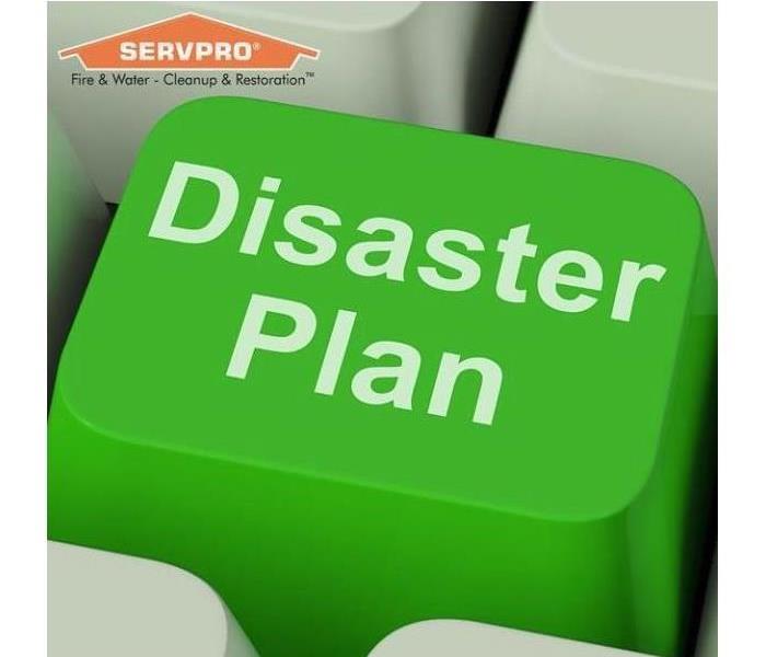 Green key on keyboard that says disaster plan with a SERVPRO logo