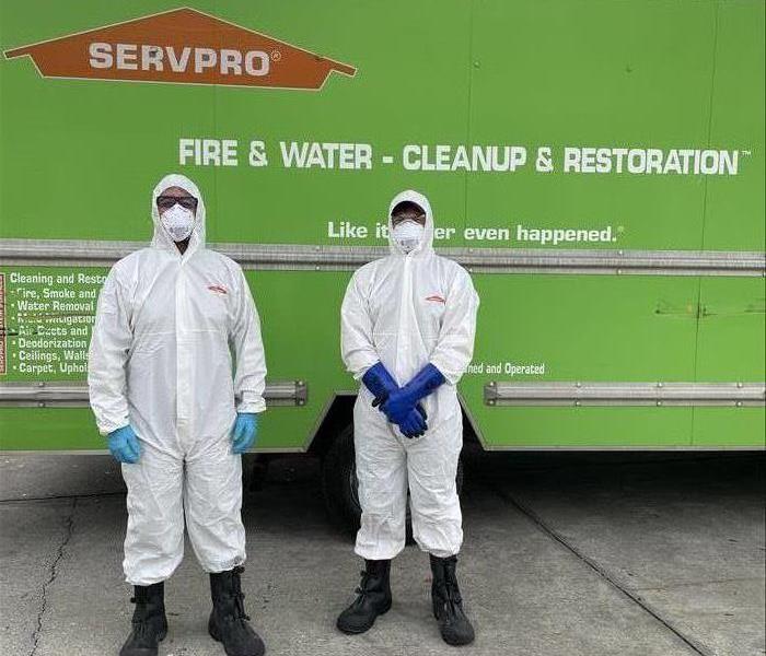 Servpro technicians in full proper protective gear to clean a biohazard situation in Edgewater